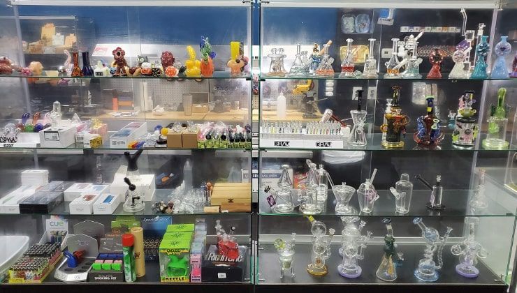Glass pipes and bubblers at Cloud 9 Vapes Airport Blvd Glass case of water pipes, bubblers and smoke shop accessories at Cloud 9 Vapes on Airport Blvd in Mobile, AL