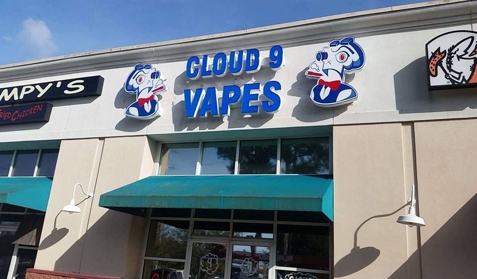 Cloud 9 Vapes Daphne storefront, open 24 hours Cloud 9 Vapes storefront sign with the mascot on US-98 in Daphne, AL
