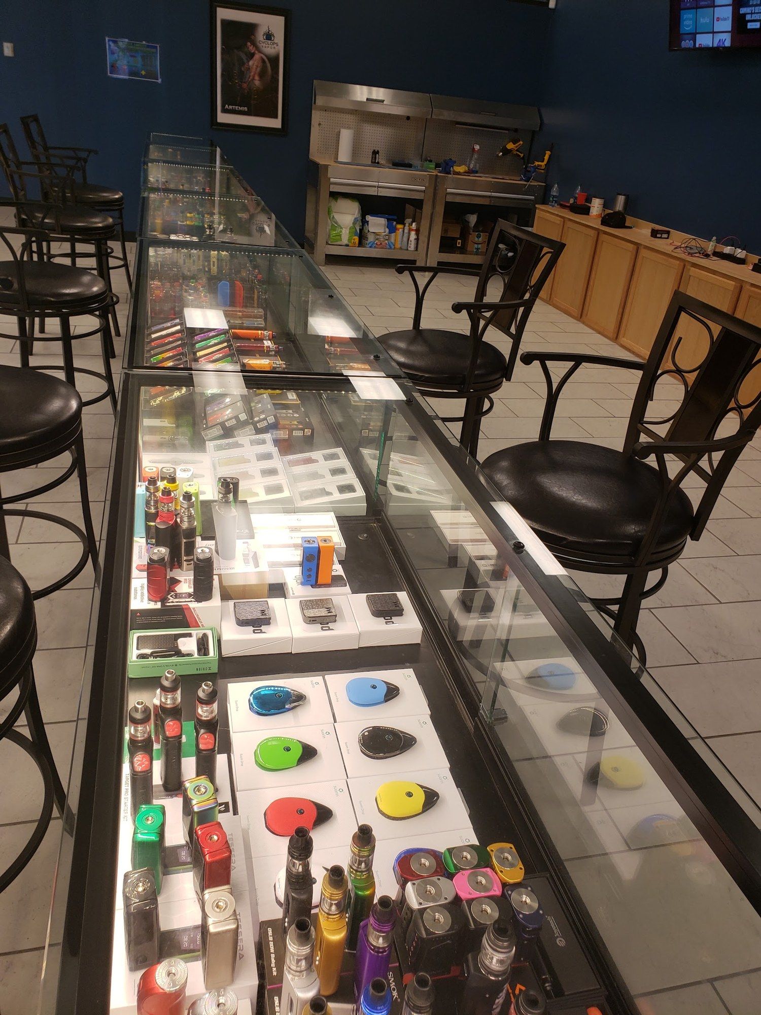 Glass display counter of vape devices and accessories at Cloud 9 Vapes in D'Iberville, MS