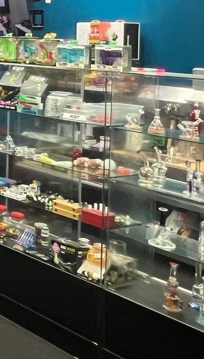 Glass pipes and bubblers at Cloud 9 Vapes Glass display case of water pipes, bubblers and smoke shop accessories at Cloud 9 Vapes