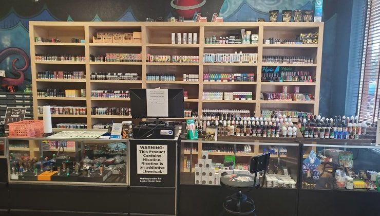 E-liquid wall at Cloud 9 Vapes Hillcrest Wall of e-liquid and devices behind the counter at the Cloud 9 Vapes 24-hour vape shop on Hillcrest Rd in Mobile, AL