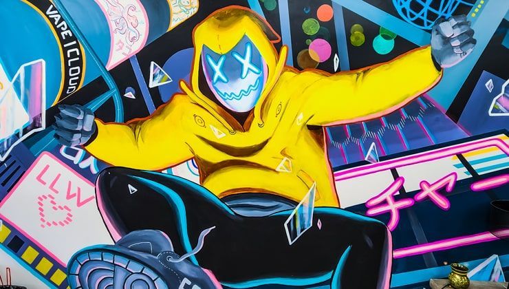 Mural at Cloud 9 Vapes Saraland Neon-style mural of a hooded figure on the wall at Cloud 9 Vapes in Saraland, AL