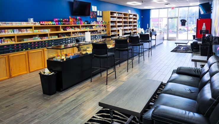 Vape lounge at Cloud 9 Vapes Saraland, AL Black leather couches in the lounge at Cloud 9 Vapes in Saraland, AL