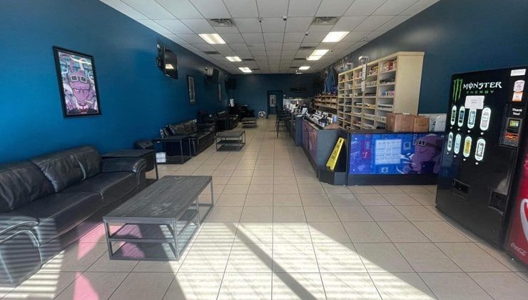 Lounge at Cloud 9 Vapes Semmes Lounge couches by the front windows at Cloud 9 Vapes in Semmes, AL