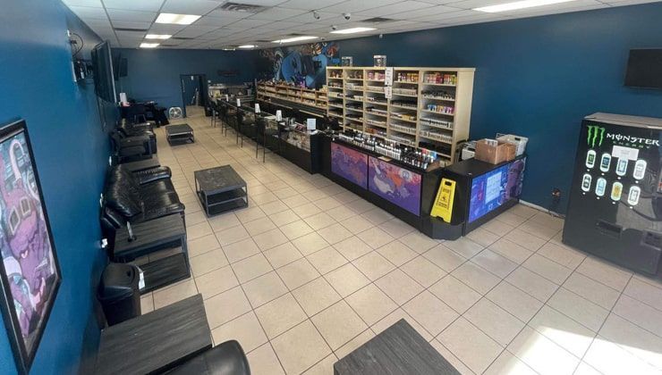 Sales floor at Cloud 9 Vapes Semmes, AL Sales floor with blue walls, couches and display counters at Cloud 9 Vapes on Moffett Rd in Semmes, AL