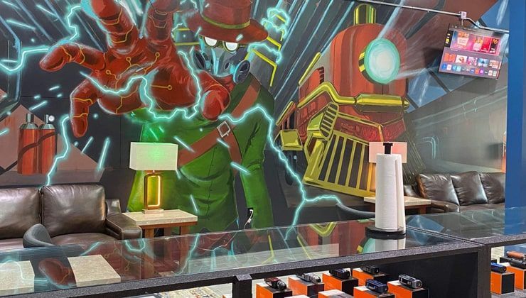 Mural at Cloud 9 Vapes Tillman's Corner Comic-style mural above the glass counter at Cloud 9 Vapes in Tillman's Corner, AL